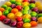 Scattered dragees of different colors. A colorful background.Closeup of the pile of colorful sweet bonbons. Scattered