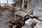 Scattered furniture and toys in an abandoned kindergarten in Pripyat. Mess and rubbish in the room. An abandoned building in the