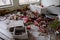 Scattered furniture and toys in an abandoned kindergarten in Pripyat. Mess and rubbish in the room. An abandoned building in the