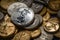 Scattered gold and silver coins with images of women angels. A pile of coins