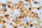 Scattered granola with nuts on grungy tabletop