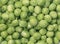 Scattered green peas close-up