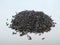 Scattered niger seed with shallow depth of field. Pile and heap of Black Color Uchellu/Gurellu. These seeds are used in masalas by