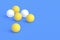 Scattered ping pong balls on blue background. Leisure games