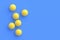 Scattered ping-pong balls on blue background. Leisure games. International competitions
