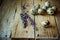 Scattered quail eggs on barn wood with lavender twigs, Easter decoration