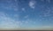 Scattered stratus clouds with smoky horizon panorama