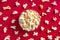 Scattered tasty cheese popcorn in bowl isolated on red background with copy space