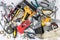Scattered tools parts and repair supplies on a white background top view