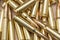 A scattering of cartridges with 7.62 caliber bullets for the Kalashnikov assault rifle, close-up, selective focusing. Concept: sal