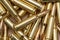 A scattering of cartridges with 7.62 caliber bullets for the Kalashnikov assault rifle, close-up, selective focusing. Concept: sal