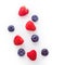 Scattering of fresh berries on a white background. Raspberries and blueberries