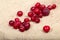 Scattering of the frozen cranberry berries on a sacking