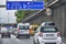 Scene on the Berlin A100 freeway with various vehicles at the start of rush hour traffic