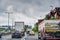 Scene on the Berlin A100 freeway with various vehicles at the start of rush hour traffic