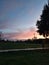 Scene of a city park at sunset, calm after the storm