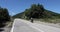 Scene of a couple of cyclists on tandem bicycle in La Garrotxa, Girona, Spain. 4K UHD