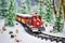 scene depicting toy train on snow-covered railroad track