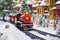 scene depicting toy train on snow-covered railroad track