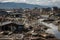 scene of devastation after tsunami, with homes and businesses destroyed and people missing