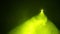 Scene illumination with a profiled yellow beam of a profile spotlight in the smoke from a smoke machine from bottom to