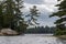 Scene from a kayak under stormy skies in Algonquin Park