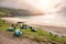 Scene at Keem beach, Tents and flock of sheep sleeping on the grass, Fog over the ocean