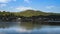 Scene of landscape view of village on mountain reflection on water