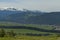 Scene with mountain top, valley and residential district of bulgarian village, Govedartsi, Rila mountain