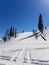 Scene of snow mountain with intersect tracks of snowmobile