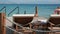 Scene of a sunny day with empty wooden deck chairs