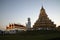 Scene of twilight time of Phop Chok ThamaChedi Phra Maha Chedi, Guan Yin Bodhisattva Statue. And chapel.