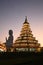 Scene of twilight time of Phop Chok ThamaChedi Phra Maha Chedi, Guan Yin Bodhisattva Statue. And chapel.