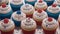 A Scene Of A Vividly Textured Table With Cupcakes With Red, White And Blue