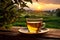 scene where a cup of tea is placed on a table, and beyond lies a breathtaking landscape view