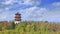 Scenery with ancient pagoda, trees and dramatic clouds at Changchun Wet Lands, China