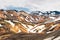 Scenery of Blahnjukur trail with volcanic mountain and snow covered in Fjallabak nature reserve on Icelandic highlands at