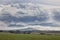 Scenery of cereals fields and little town with castle between th