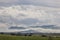 Scenery of cereals fields and little town with castle between th