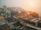 Scenery of colorful ruined slums and other histrorical buildings on the banks of river Ganges during sunset in Varanasi, India