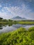 The scenery in East Java with the beauty of green grass and dashing mountains and beautiful lakes