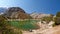 Scenery Fann mountains in Tajikistan. Wild mountain nature with lake on clear day. Beautiful Kulikalon lake in Fan mountains.