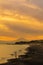 Scenery Kamakura Yuigahama Beach with Kamakura city and Fujisan mountain. Twilight silhouette Mount Fuji behind Enoshima island at