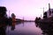 A scenery at Malacca river with various historical sites and tourist spots during the evening