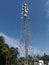 A scenery of a mobile tower with the blue sky