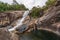 Scenery of Murray Falls streaming over peculiar rocks, Queensland, Australia