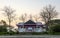 Scenery of a pink and white old concrete house abandoned mysteriously