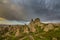 Scenery in the Romanian Alps, with stormy cloudscape and granite slabs