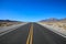 Scenery route through Death Valley National Park, lonesome road in the deser. Tourism and vacations concept, California United Sta