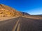 Scenery route through Death Valley National Park - lonesome road in the desert